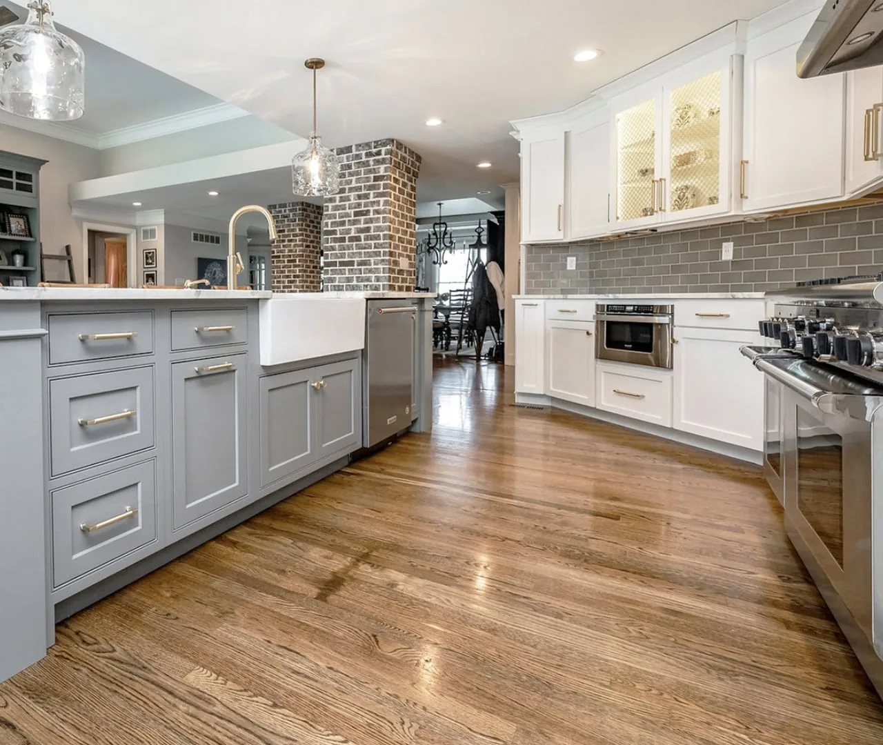 Custom cabinetry with a fluted island panel and open shelving