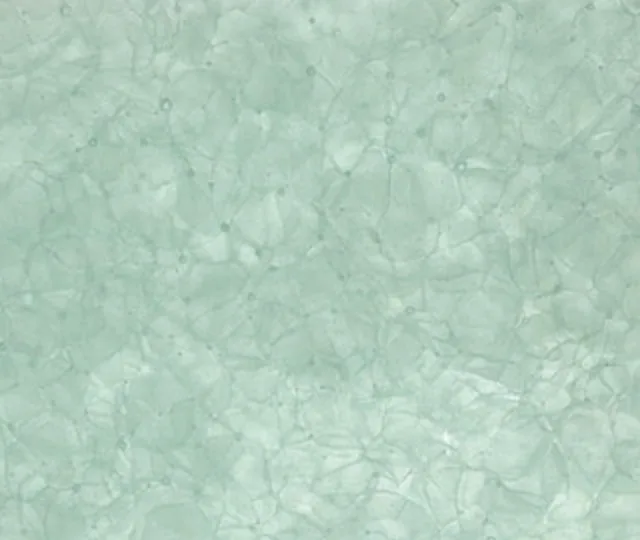 Recycled glass surface in pale sea green