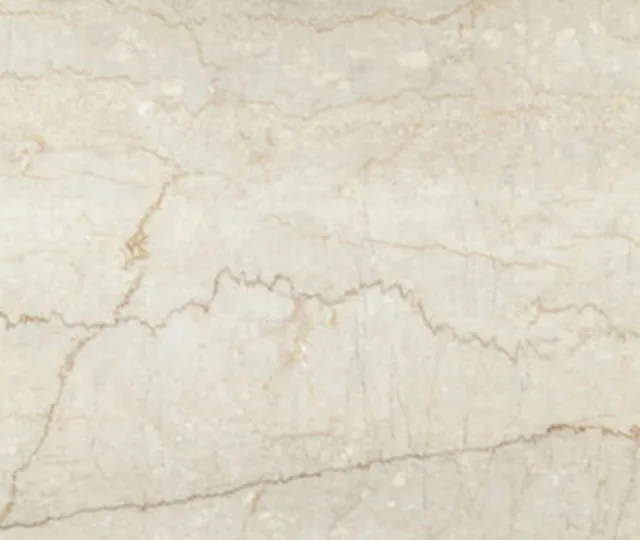 Natural stone surface in warm cream with amber veining